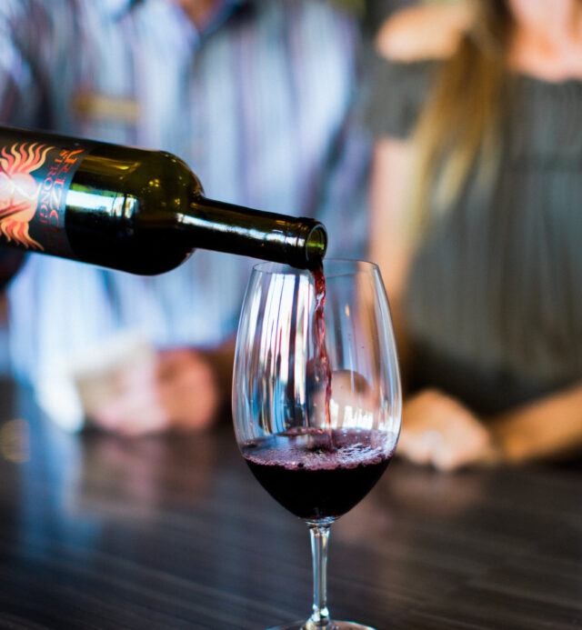 glass of wine being poured